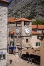 Clock tower at the square in Kotor old town, Montenegro. Royalty Free Stock Photo